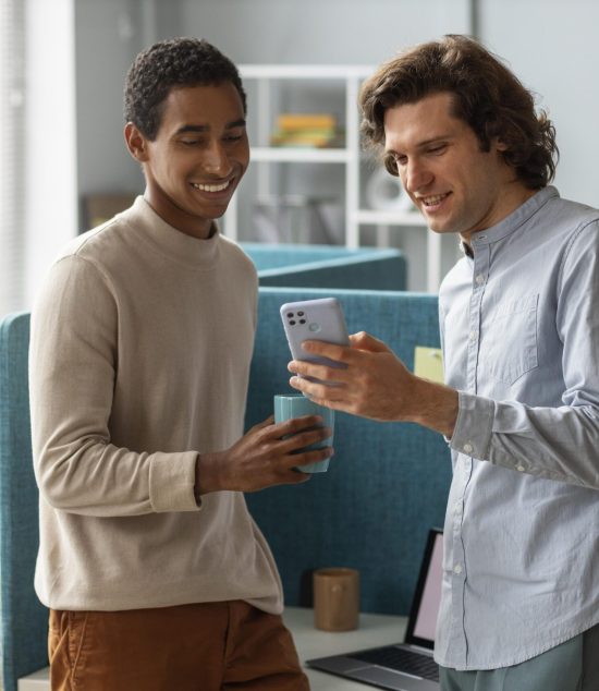 medium-shot-colleagues-with-smartphone-min